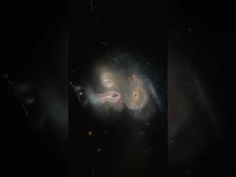 hubble captured 3 galaxies merging